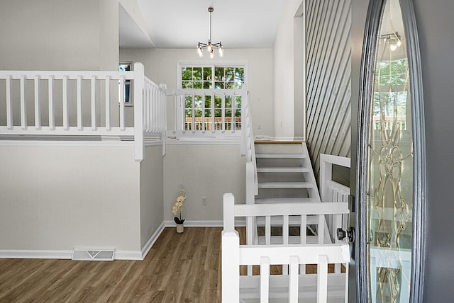 105 Brailsford Rd, Summerville, SC 29485 - staircase with baseboards, a notable chandelier, wood finished floors, and visible vents