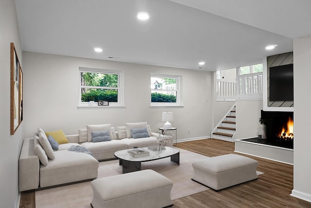 105 Brailsford Rd, Summerville, SC 29485 - living room featuring plenty of natural light, wood finished floors, and a lit fireplace