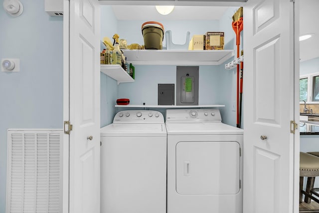 laundry area with washing machine and clothes dryer