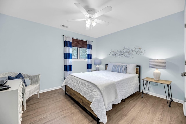 bedroom featuring ceiling fan and light wood-type flooring