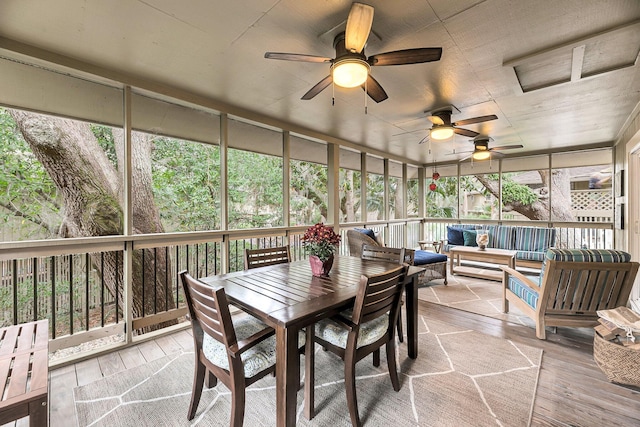 sunroom / solarium with ceiling fan