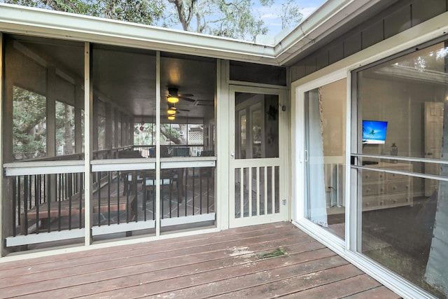 wooden terrace featuring a sunroom