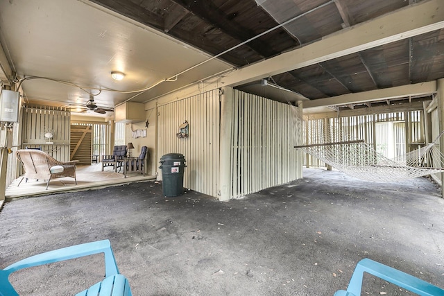 misc room featuring concrete flooring and ceiling fan