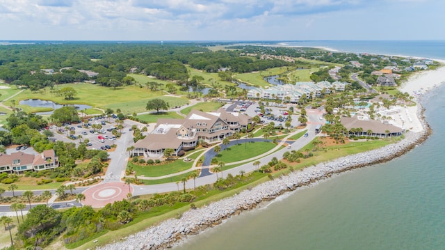 drone / aerial view with a beach view and a water view