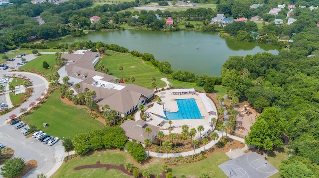 birds eye view of property with a water view