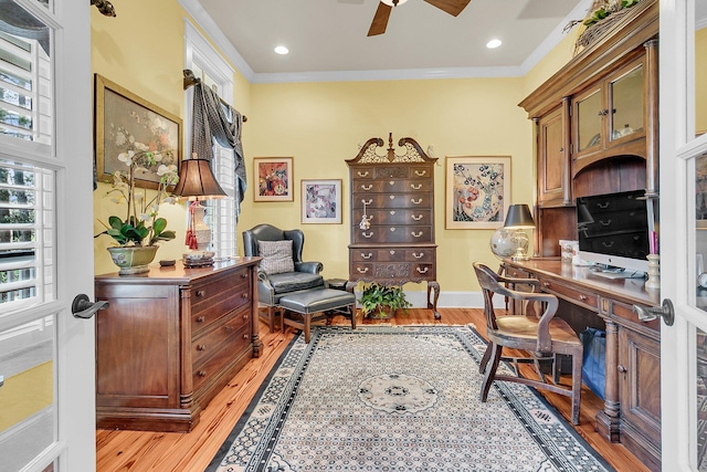 office with light hardwood / wood-style flooring, ornamental molding, and ceiling fan