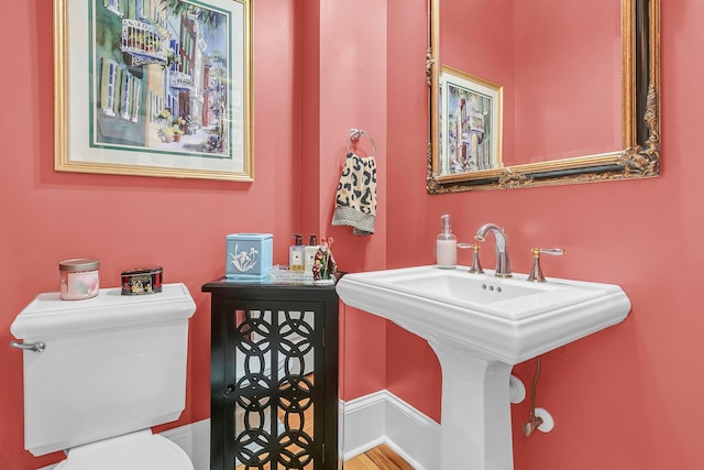 bathroom with sink and toilet