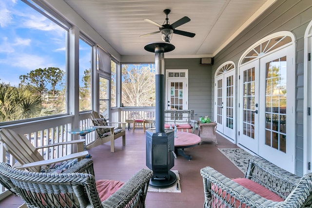 sunroom with ceiling fan and french doors