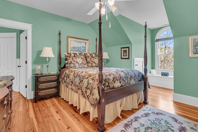 bedroom featuring ceiling fan, vaulted ceiling, and light hardwood / wood-style flooring