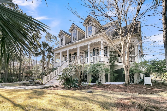 view of front of home featuring a porch and a front lawn