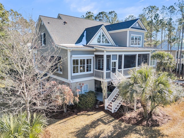 back of house featuring a sunroom