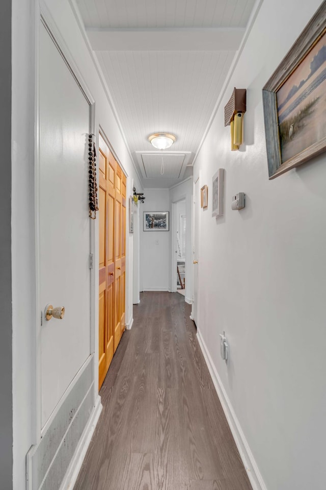 corridor with wooden ceiling and dark hardwood / wood-style floors