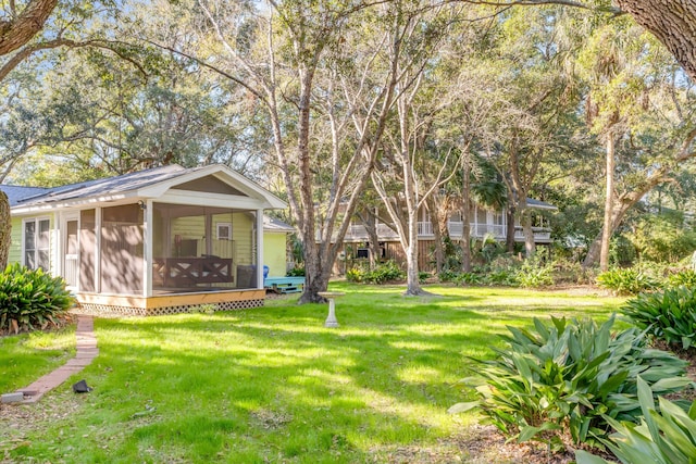 view of yard with a sunroom