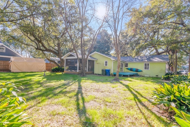 view of yard with a sunroom