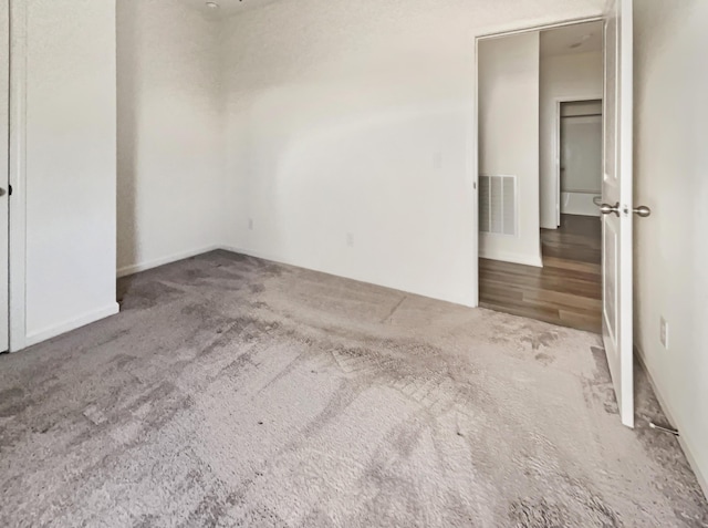 carpeted spare room with visible vents