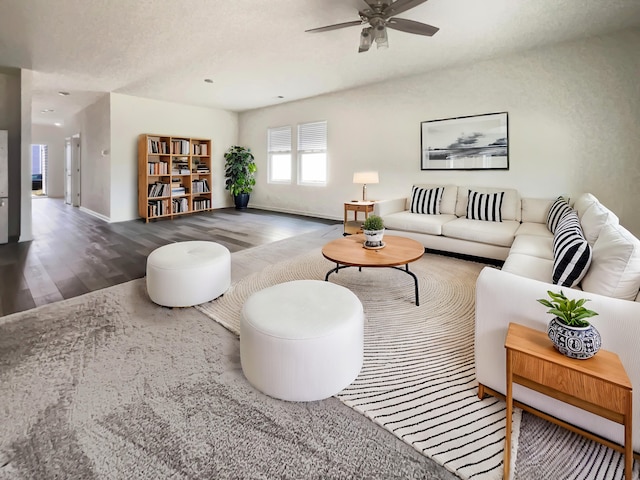 living area featuring a ceiling fan and wood finished floors