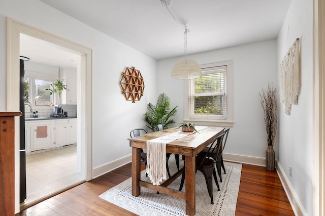 dining area with hardwood / wood-style floors and plenty of natural light