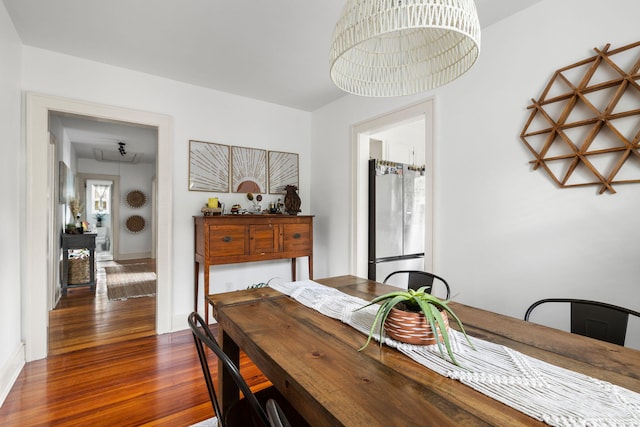 dining area featuring dark hardwood / wood-style flooring