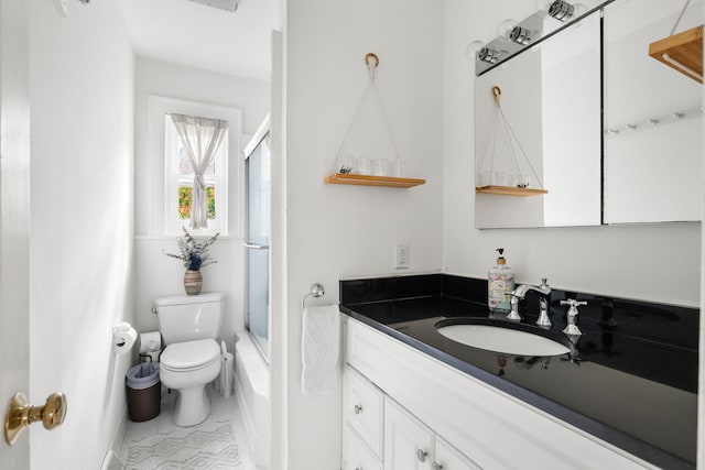 full bathroom featuring shower / bath combination with glass door, vanity, toilet, and tile patterned floors