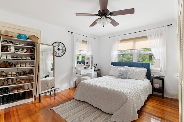 bedroom featuring wood-type flooring and ceiling fan