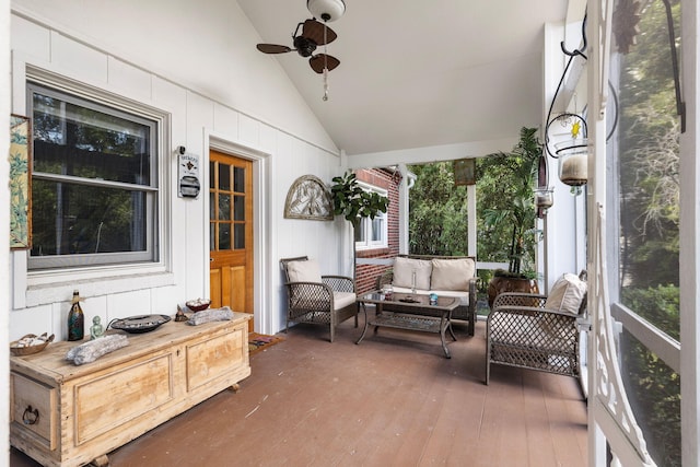 sunroom / solarium featuring vaulted ceiling and ceiling fan