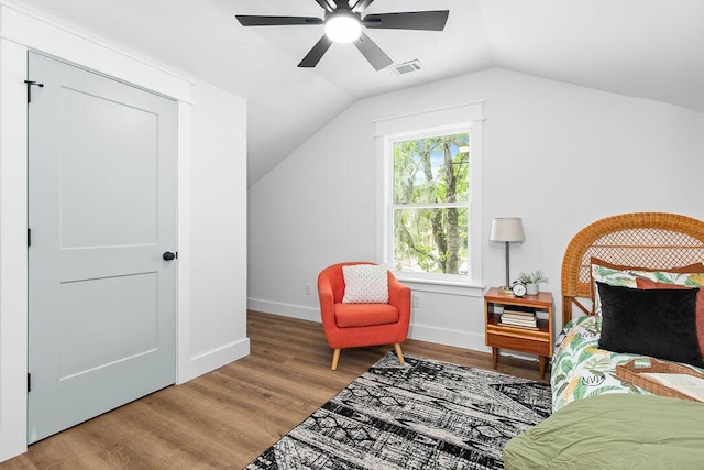 bedroom with multiple windows, hardwood / wood-style flooring, ceiling fan, and lofted ceiling