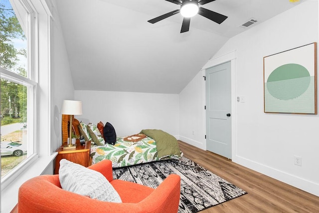 living area featuring wood-type flooring, ceiling fan, and lofted ceiling