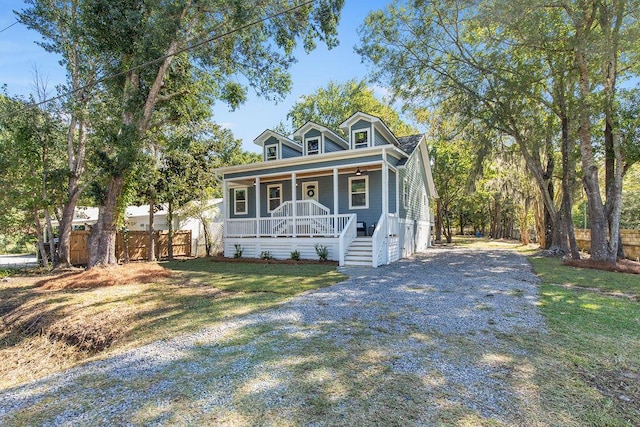 view of front of house featuring a porch and a front yard