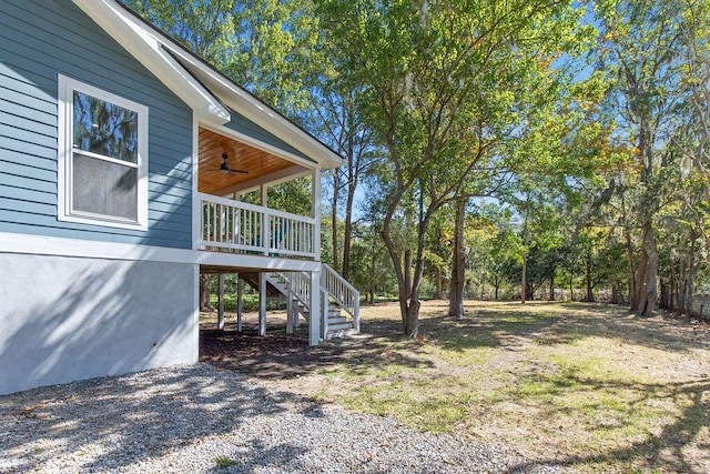 view of yard featuring ceiling fan