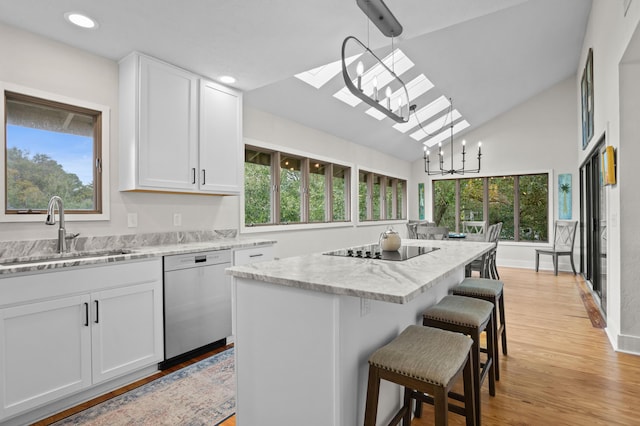 kitchen with white cabinetry, dishwasher, sink, pendant lighting, and a kitchen island