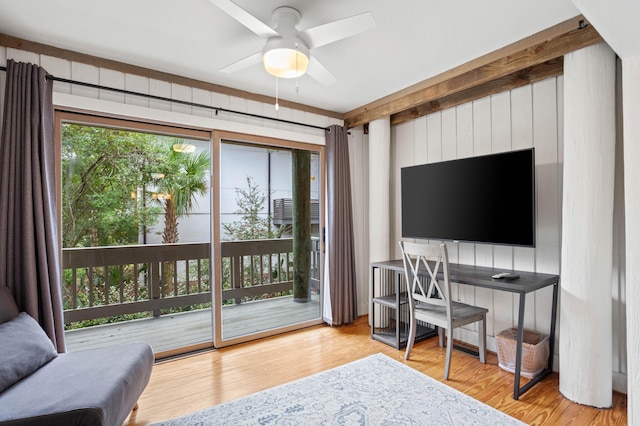 home office with ceiling fan and light hardwood / wood-style flooring