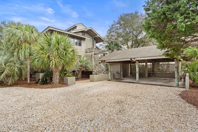 rear view of house with a carport