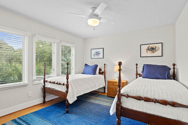 bedroom featuring wood-type flooring and ceiling fan