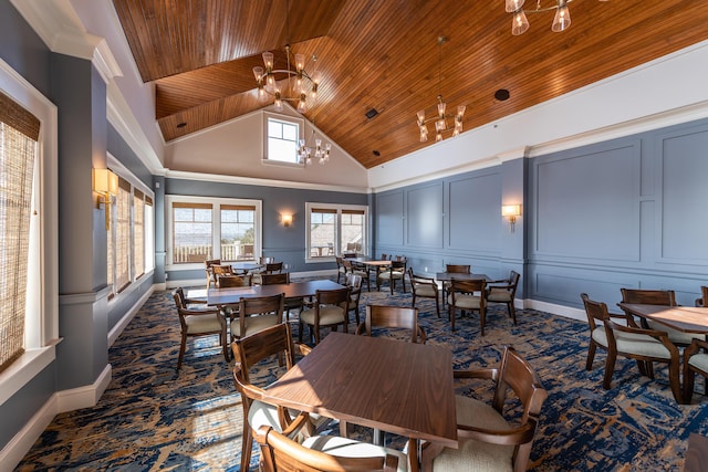 dining room with wood ceiling, high vaulted ceiling, and an inviting chandelier