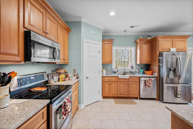 kitchen featuring decorative light fixtures, crown molding, stainless steel appliances, visible vents, and a sink