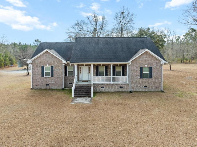 view of front of house with a porch, crawl space, a shingled roof, and brick siding