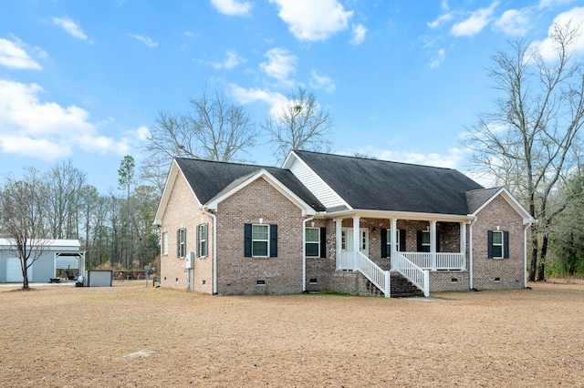 view of front of property with crawl space, covered porch, brick siding, and roof with shingles