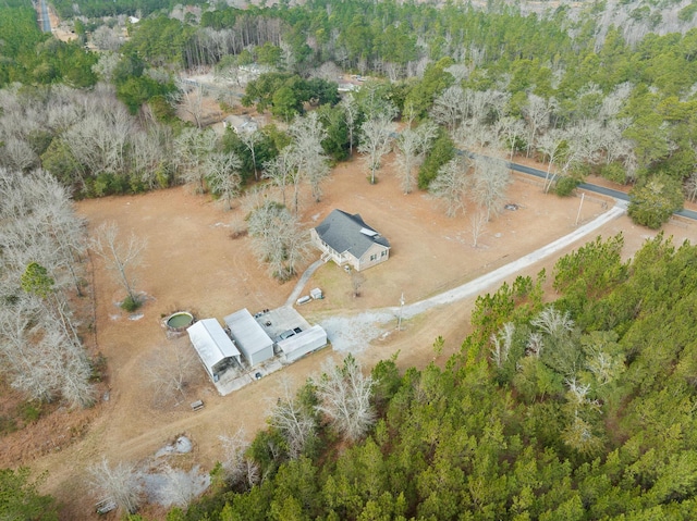 bird's eye view featuring a wooded view