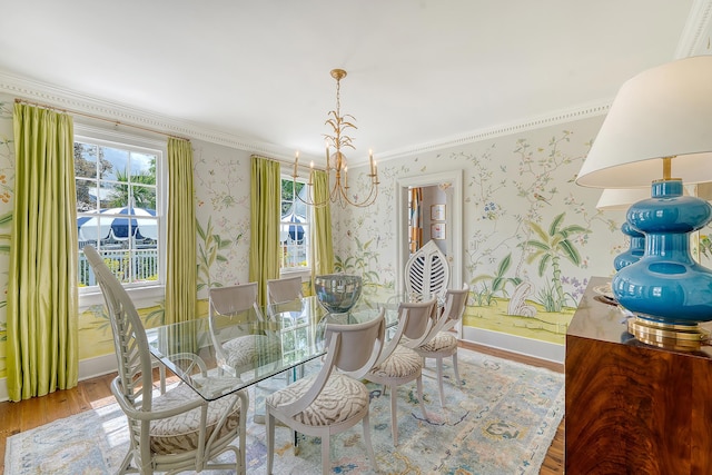 304 Bank St, Mount Pleasant, SC 29464 - dining space with wallpapered walls, a chandelier, wood finished floors, ornamental molding, and baseboards