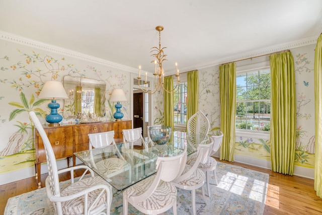 304 Bank St, Mount Pleasant, SC 29464 - dining area featuring a chandelier, wallpapered walls, wood finished floors, crown molding, and baseboards