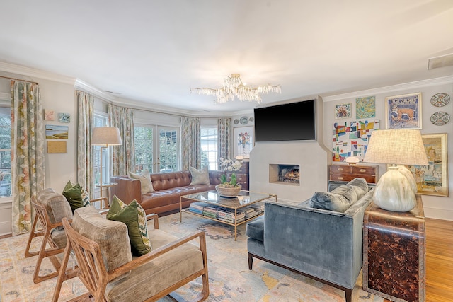304 Bank St, Mount Pleasant, SC 29464 - living room featuring crown molding, a chandelier, and a fireplace