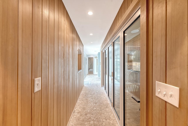 304 Bank St, Mount Pleasant, SC 29464 - hall with light stone finish floors, recessed lighting, and wood walls
