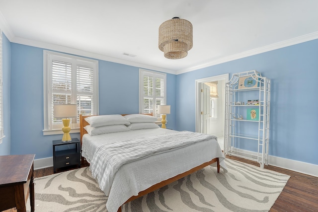 304 Bank St, Mount Pleasant, SC 29464 - bedroom featuring baseboards, wood finished floors, and crown molding
