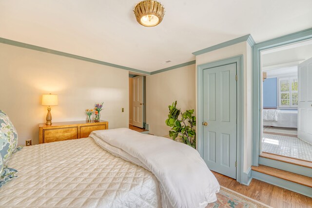 304 Bank St, Mount Pleasant, SC 29464 - bedroom with wood finished floors and crown molding