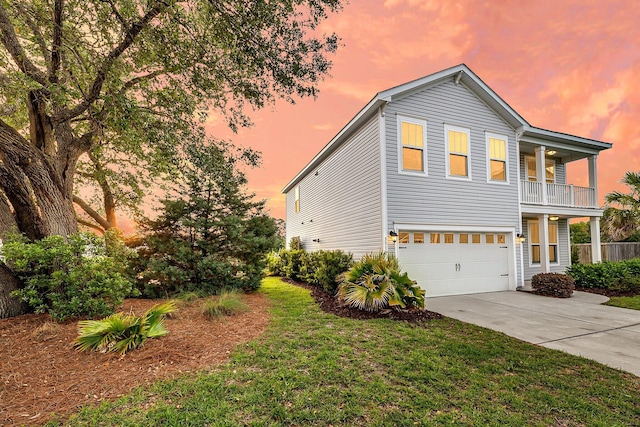 3310 Hartwell St, Johns Island, SC 29455 - property exterior at dusk featuring an attached garage, driveway, and a lawn