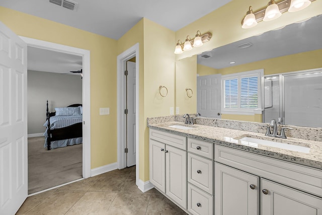 3310 Hartwell St, Johns Island, SC 29455 - ensuite bathroom featuring double vanity, baseboards, a shower with shower door, and tile patterned floors