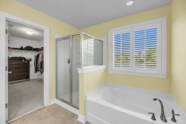 3310 Hartwell St, Johns Island, SC 29455 - full bathroom with a shower stall, a garden tub, a spacious closet, and tile patterned floors