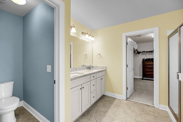 3310 Hartwell St, Johns Island, SC 29455 - bathroom featuring double vanity, a spacious closet, toilet, tile patterned floors, and baseboards