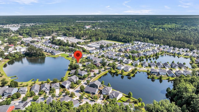 3310 Hartwell St, Johns Island, SC 29455 - aerial overview of property's location featuring a heavily wooded area, a large body of water, and nearby suburban area