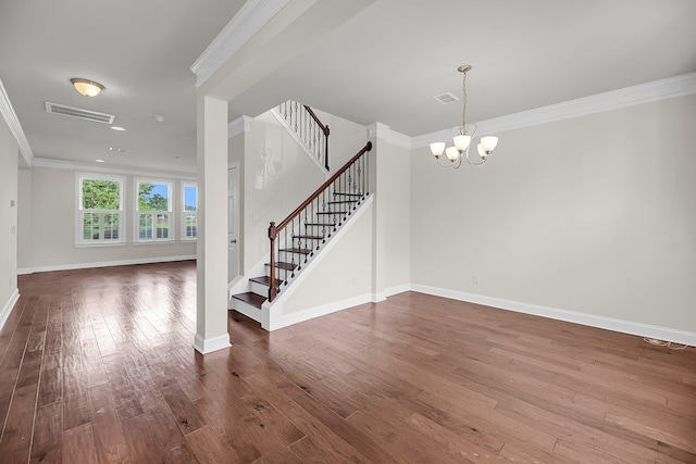 3310 Hartwell St, Johns Island, SC 29455 - entrance foyer with stairs, crown molding, baseboards, wood-type flooring, and a chandelier